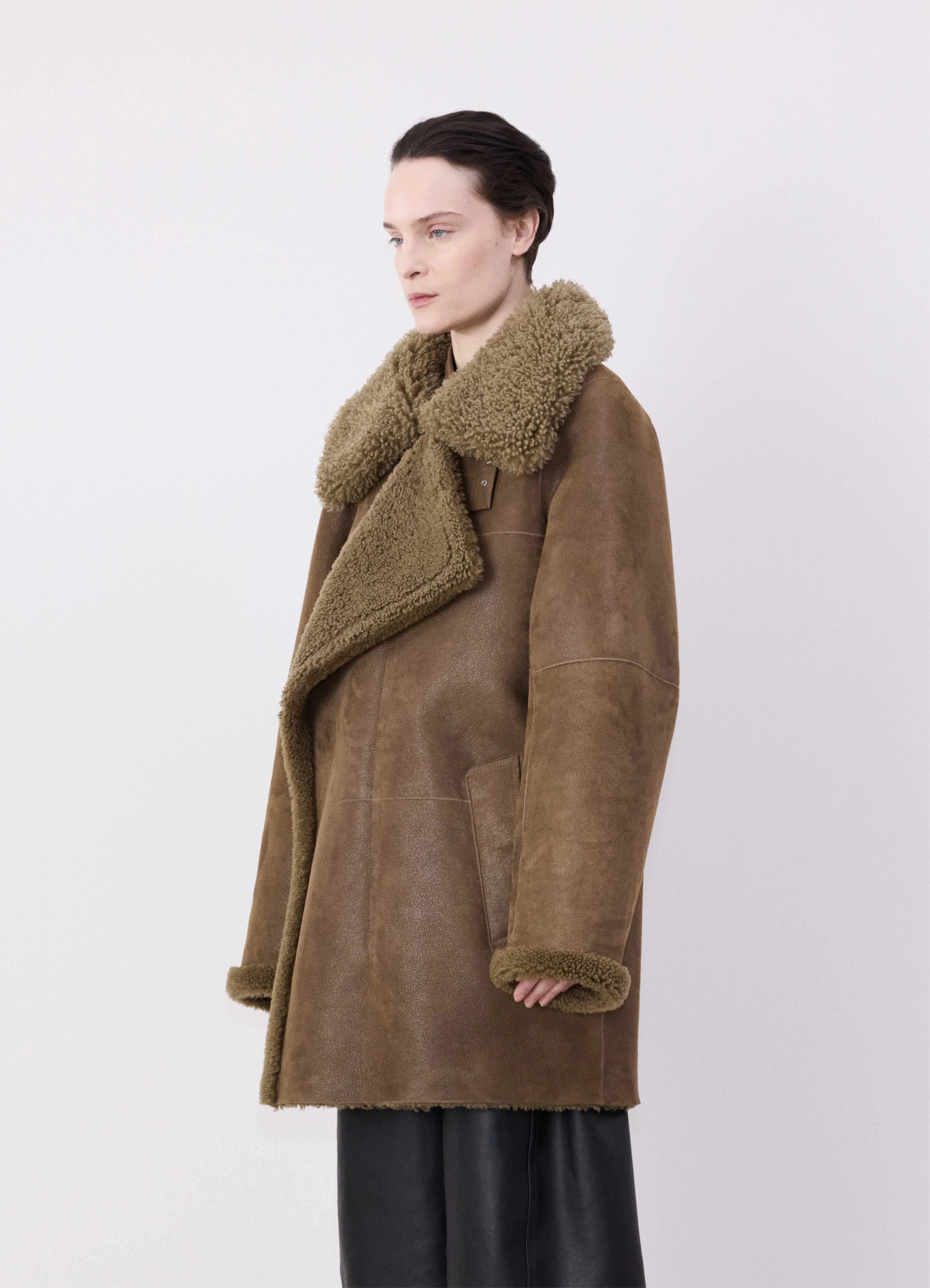 zip-up jacketASYMMETRICAL SHEARLING COAT